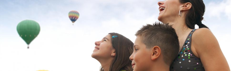 family watching hot air balloons
